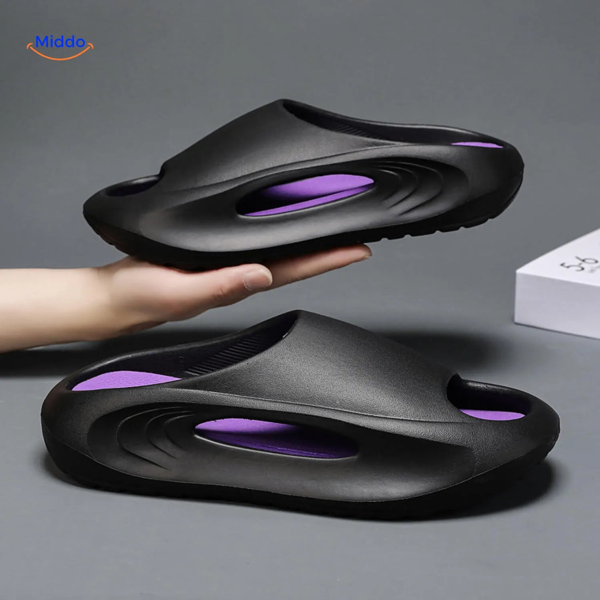 Aerostep thick-sole sport sandals in black with purple accent stripe styling.