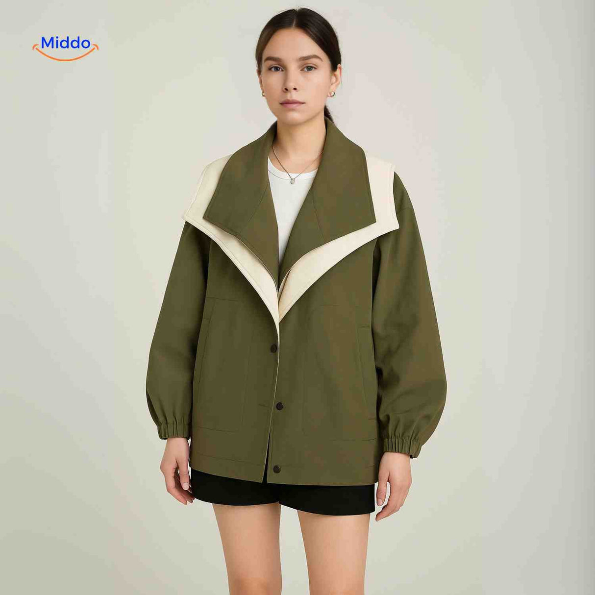 Trendy AquaShell trench coat in green with contrast collar styling.