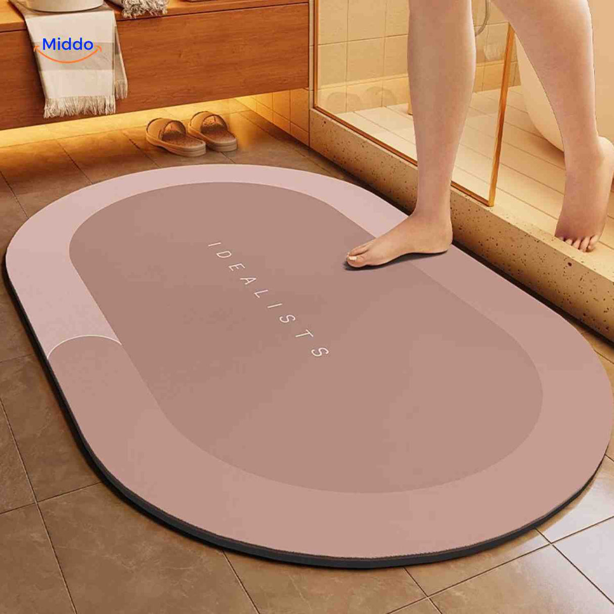 Brown oval water-absorbing quick-dry bath mat maintains non-slip grip.