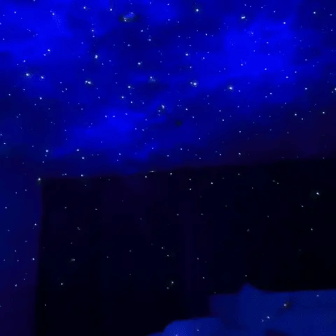 Astronaut galaxy projector creating starfield ceiling projection with constellation patterns.