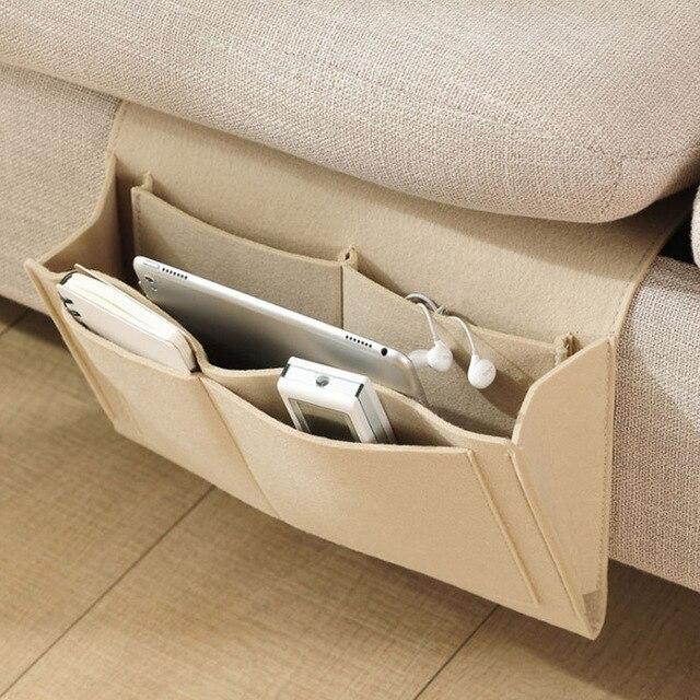 BedCaddy bedside storage organizer in warm beige felt with storage pockets.