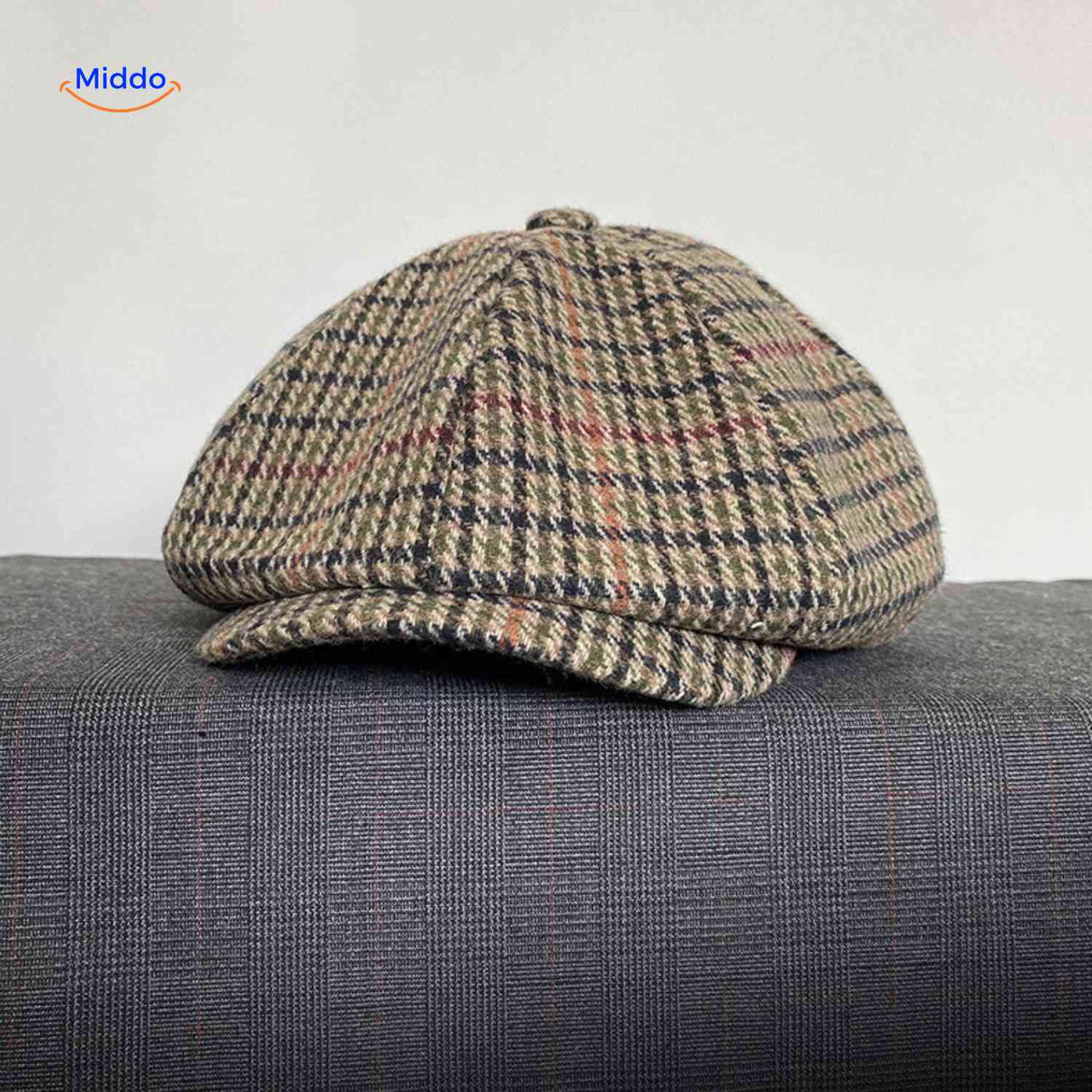 Beige and red plaid wool vintage cap with all-season comfort.