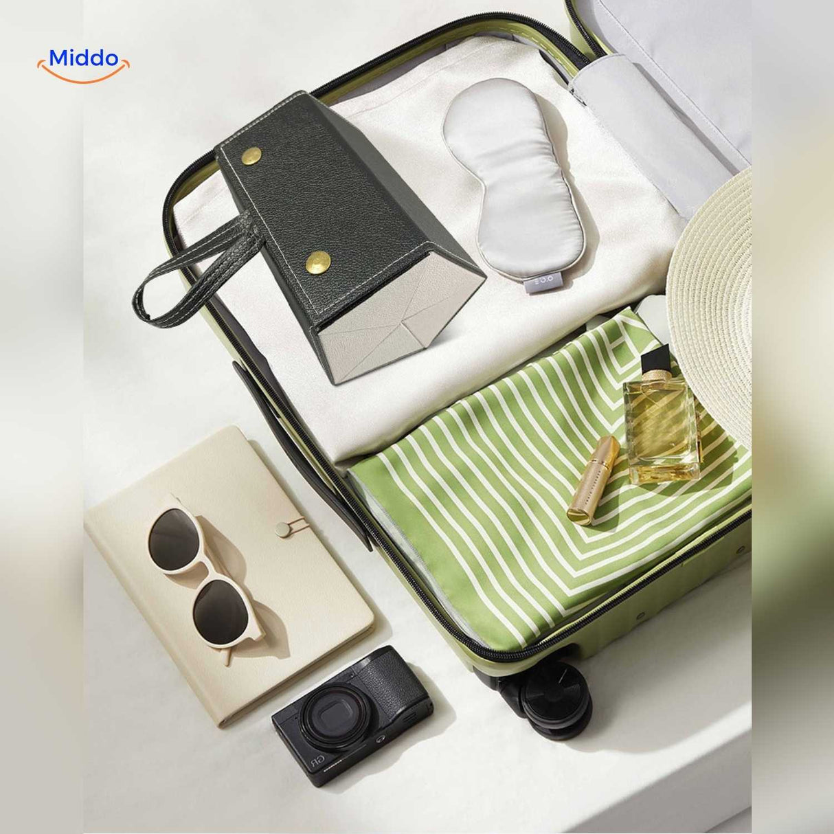 Black 2-slot foldable eyeglasses case tucked neatly into an open suitcase for travel.
