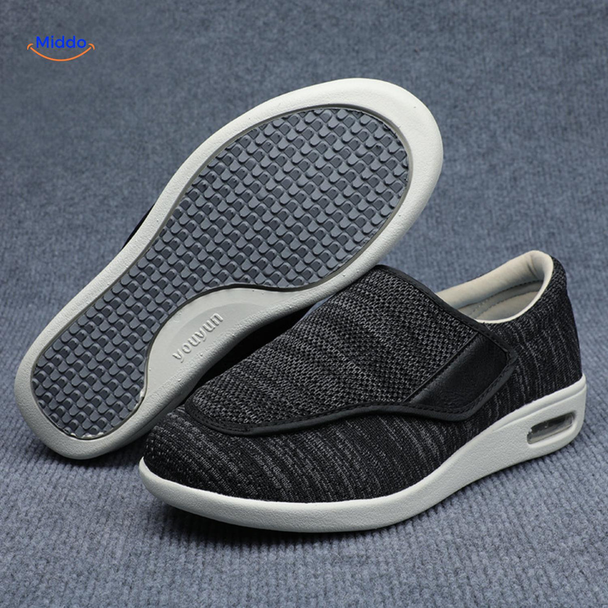 Black support shoes with gray accents and air-cushion sole technology.