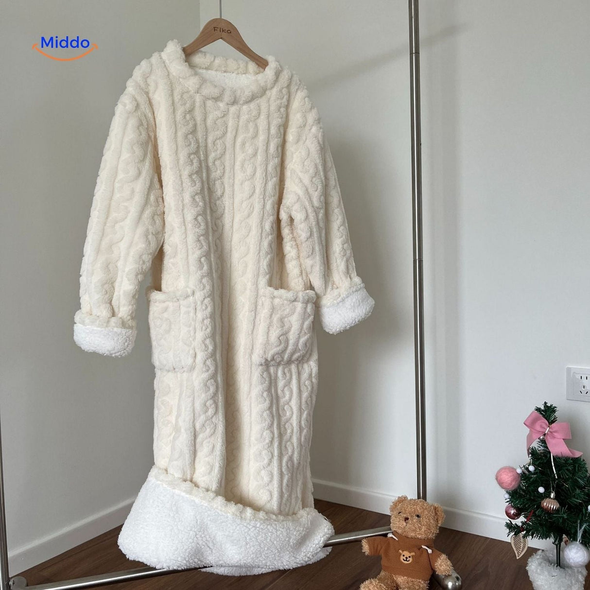 White Snugglewear robe with sherpa borders and functional pockets.