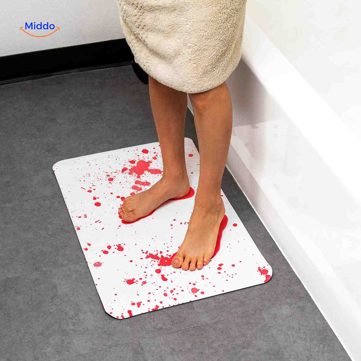Color-changing bathroom mat creates blood splatter visual effect.