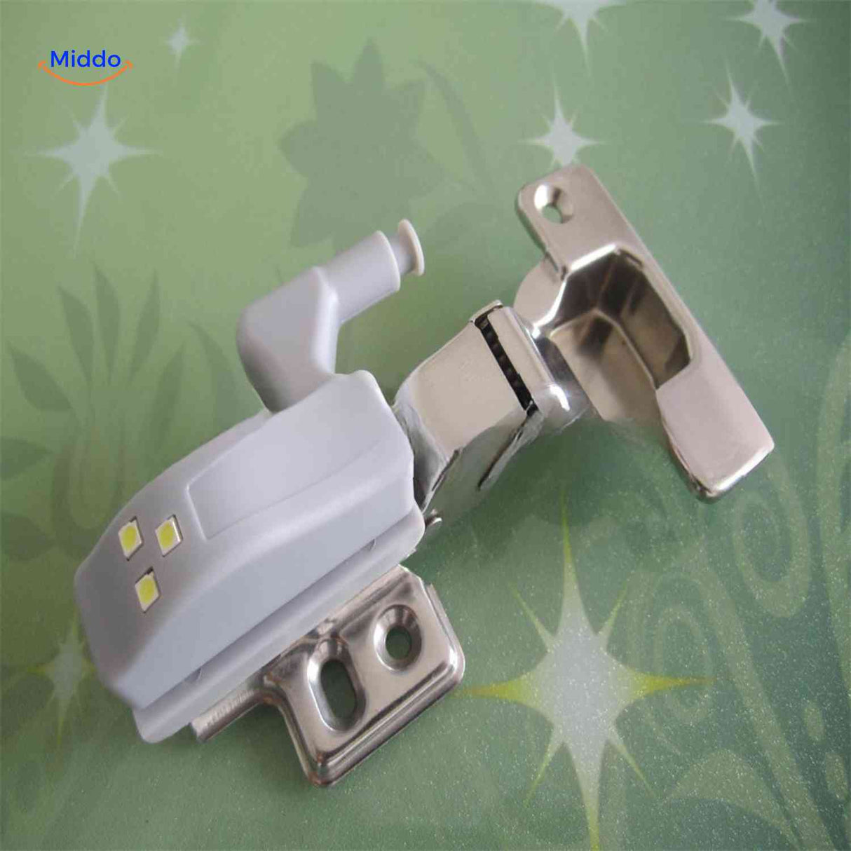 Close-up view of Cabintra LED light mounted directly on cabinet door hinge.