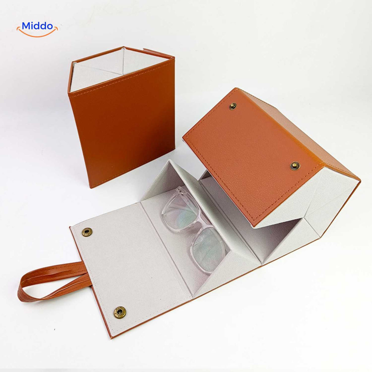Caramel 2-slot foldable eyeglasses case open with a pair of clear-frame glasses resting inside.