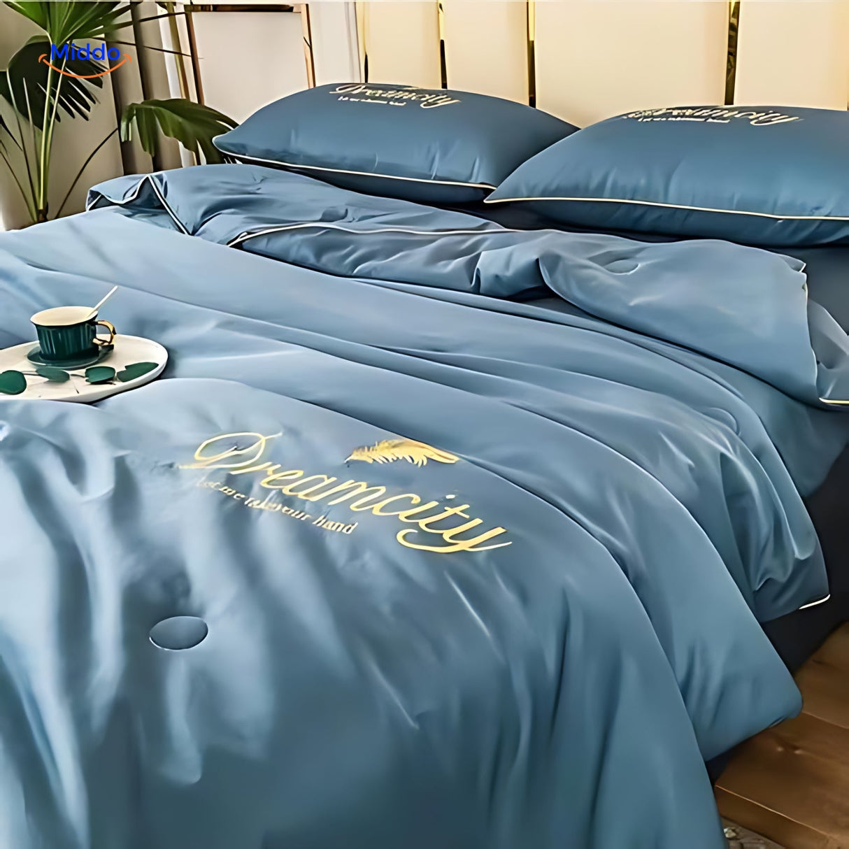 DreamCity cooling blanket draped on bed, showing actual use and premium appearance.