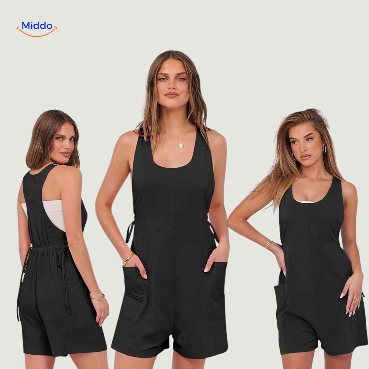 Dark gray jumpsuit featuring decorative tie details and side pockets.