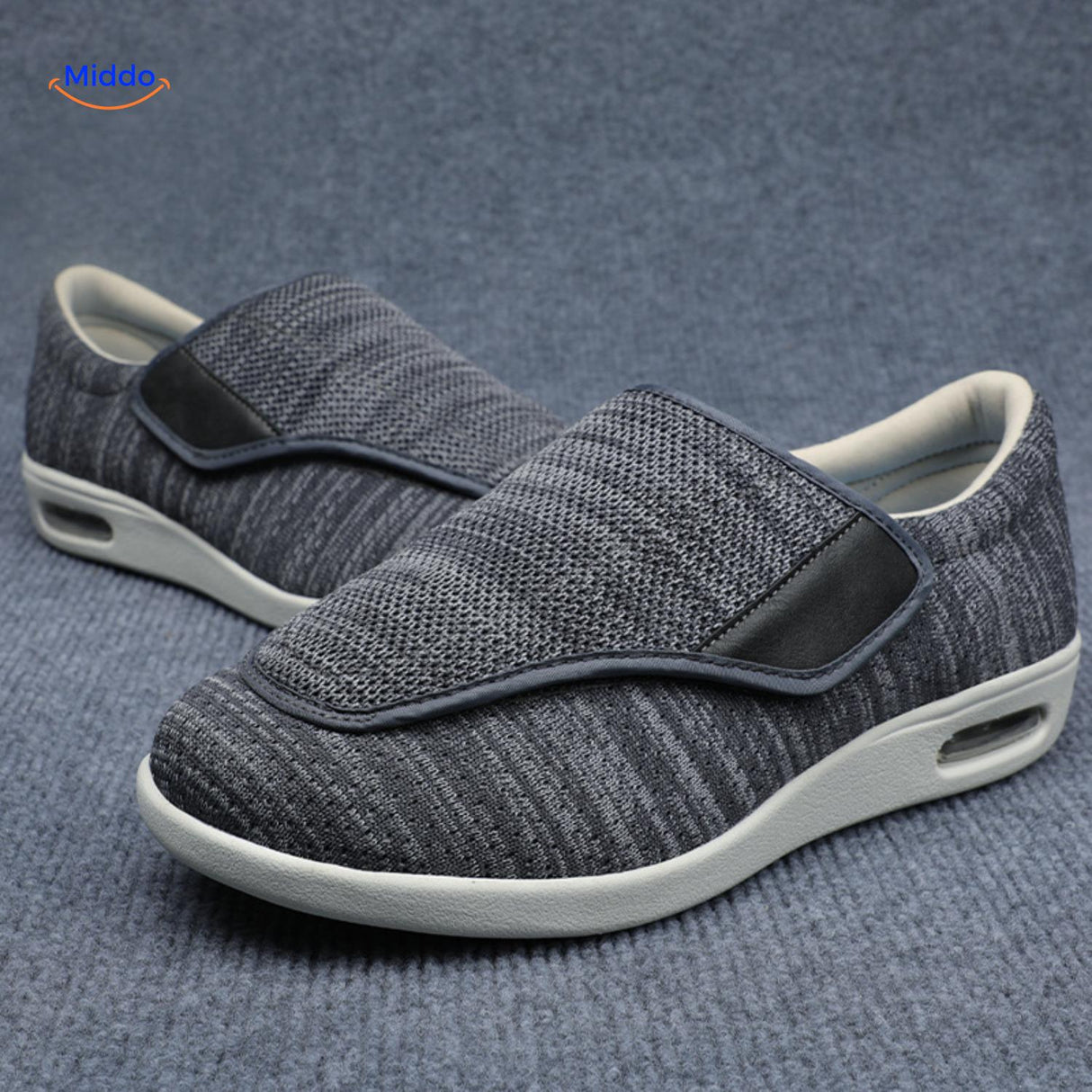 Dark gray therapeutic shoes with adjustable velcro closure.