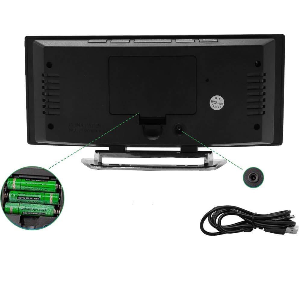Back view of alarm clock showing battery compartment and USB power charging port.