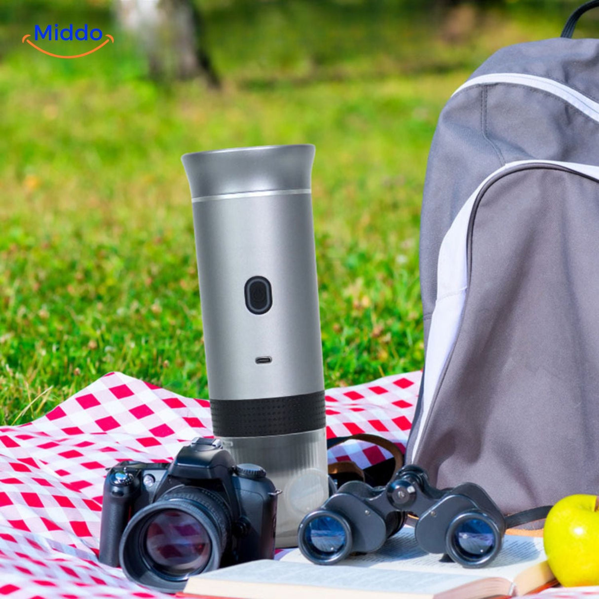 Portable espresso machine with capsules and additional accessories displayed.