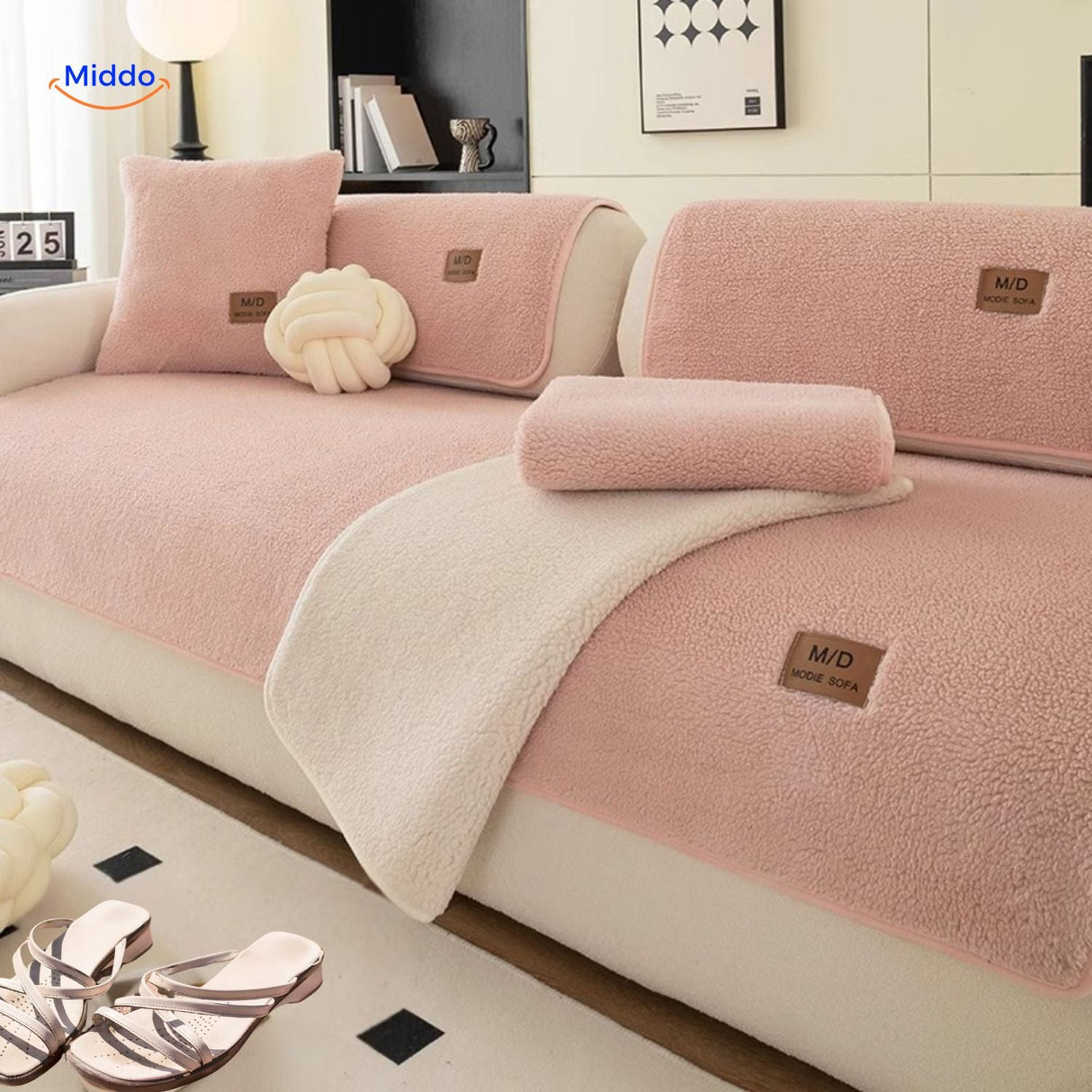 Soft faux lambswool cover styled with warm rose-colored luxury blankets.