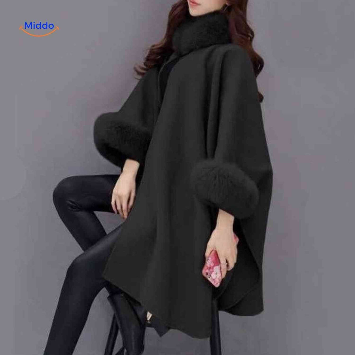 Furina black wool cape coat showing luxe faux-fur collar accent and structured neckline.