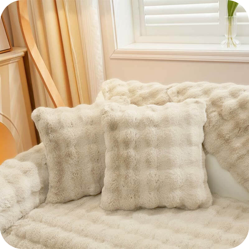 Complete white plush bundle with sofa covers, pillows and blanket for cozy living.