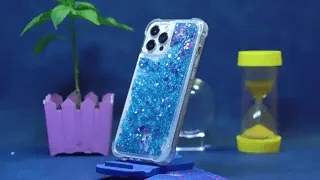 GlowSand phone case blue glitter liquid with sparkle glow-in-dark effect.