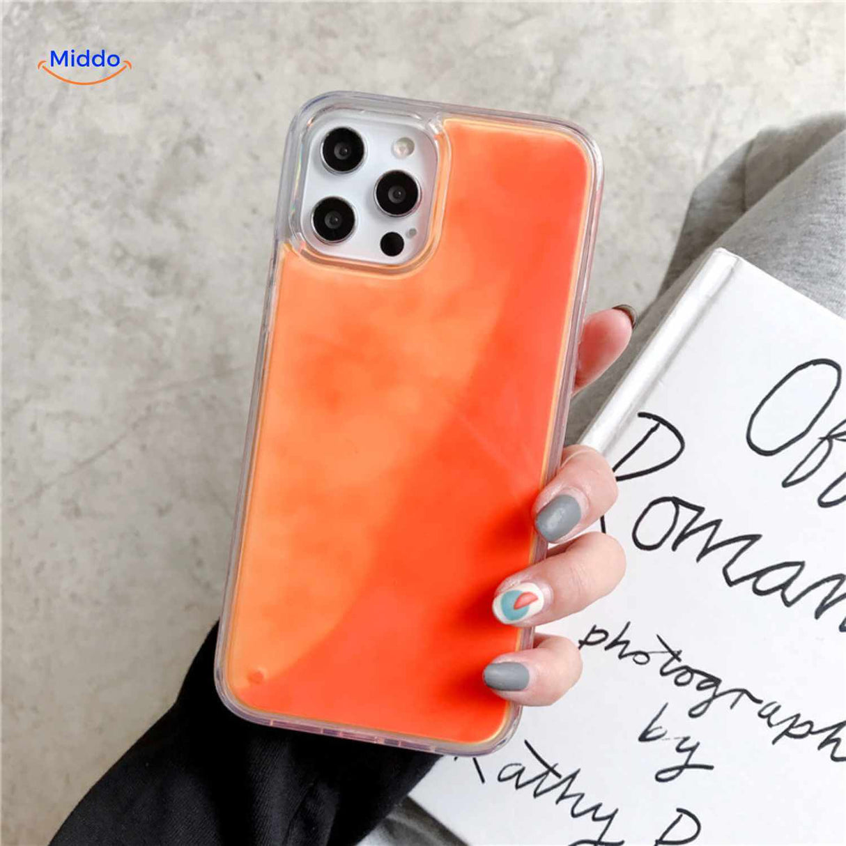 GlowSand phone case with clear orange liquid sand design and protective drop shield.