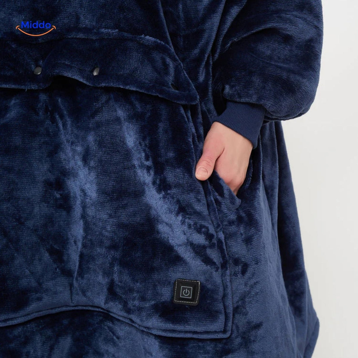 Close-up of the easy-to-use heat control button on the blue USB heated sweater.