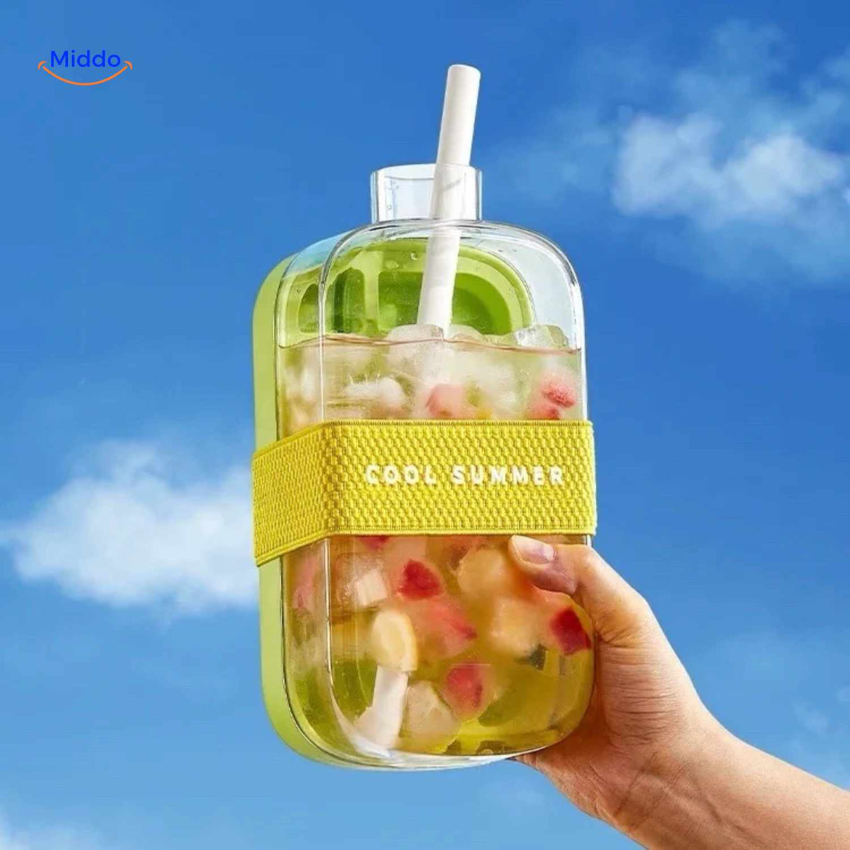 Green ice bottle holding cold drink with fruit and ice cube mix