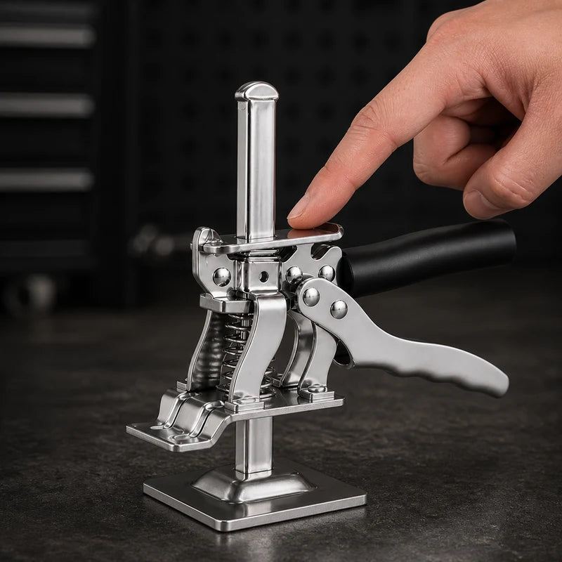 A fingertip presses the top release plate of KrikFix 2.0 for controlled lowering