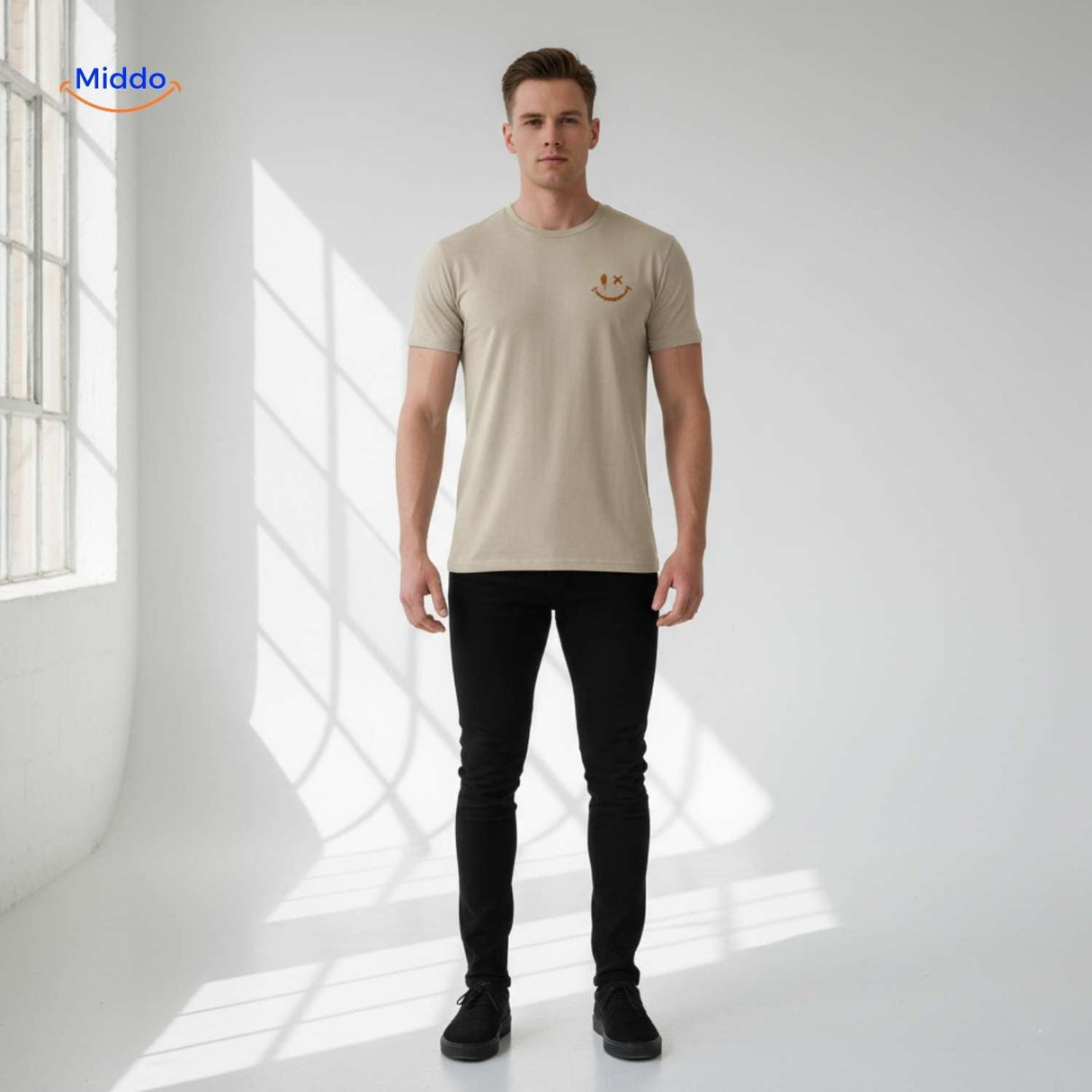 Beige summer t-shirt with smiley design worn in relaxed men's casual style.