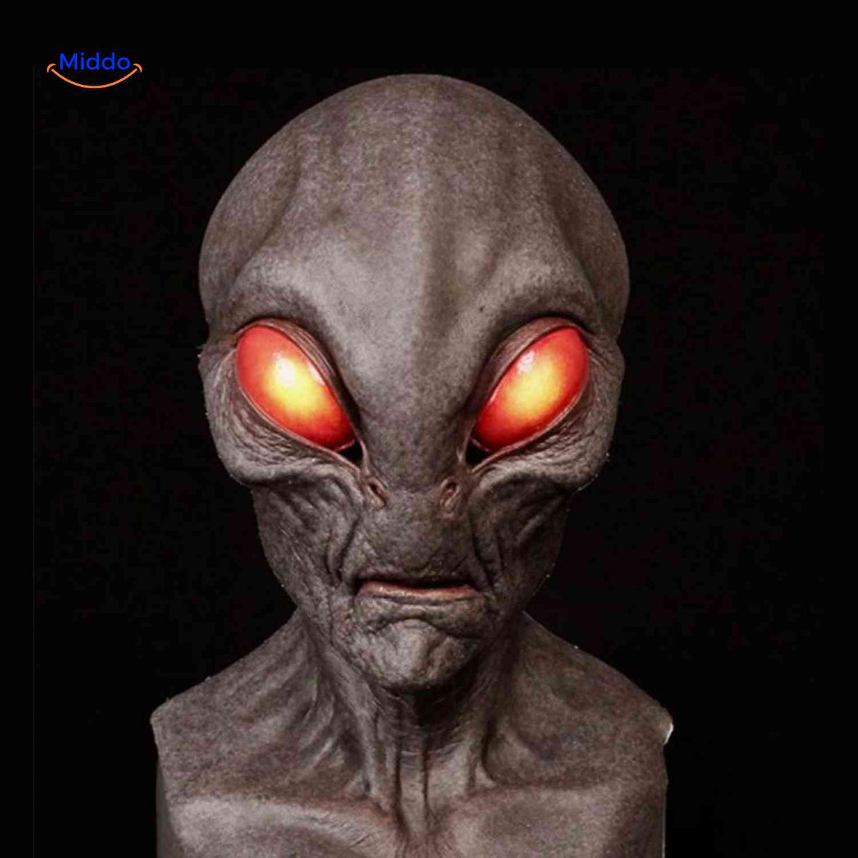 Aged latex mask with red eyes and alien-inspired character design.