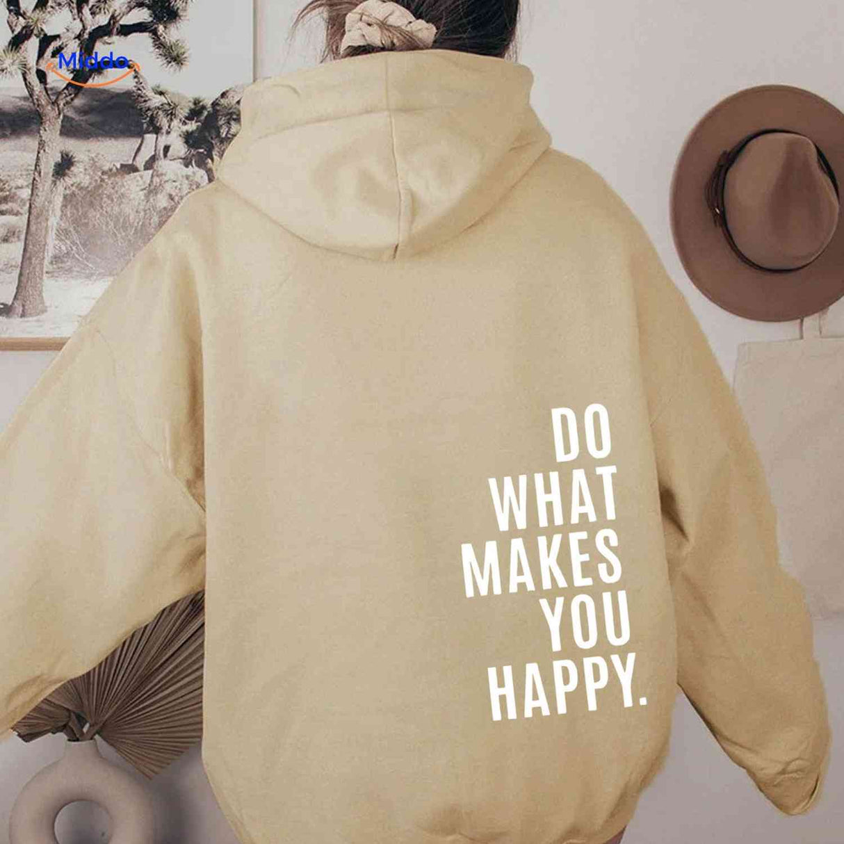 Beige oversized hoodie featuring white inspirational message.
