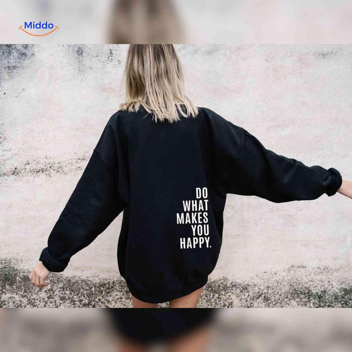 Black oversized hoodie with white motivational text.