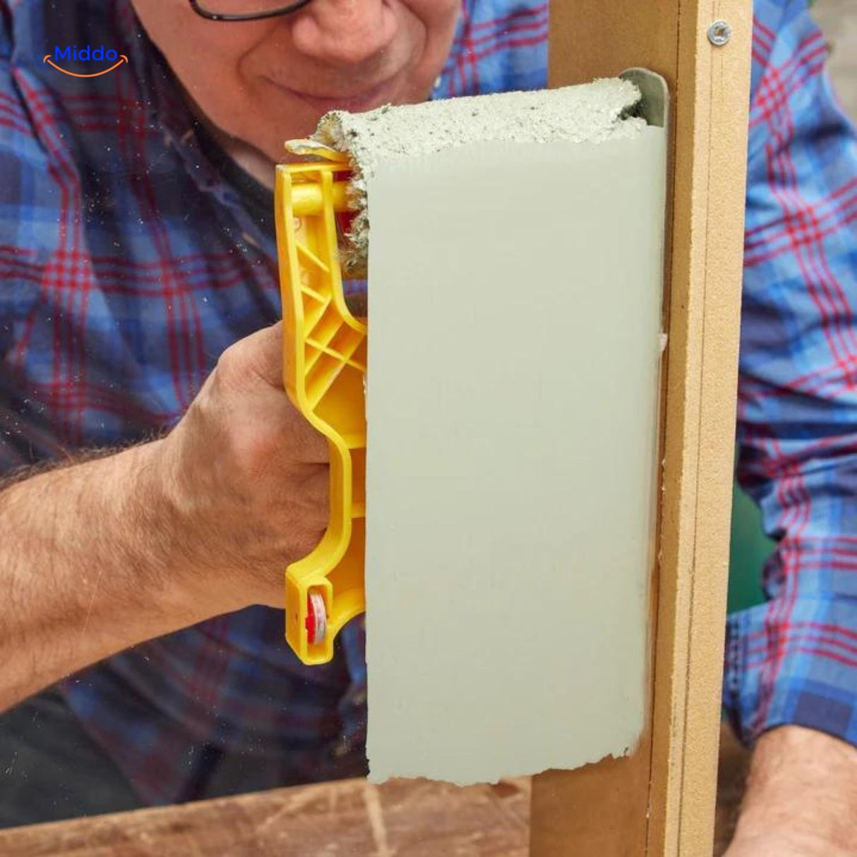 Paint edging tool in use applying paint cleanly around wall edges without tape.