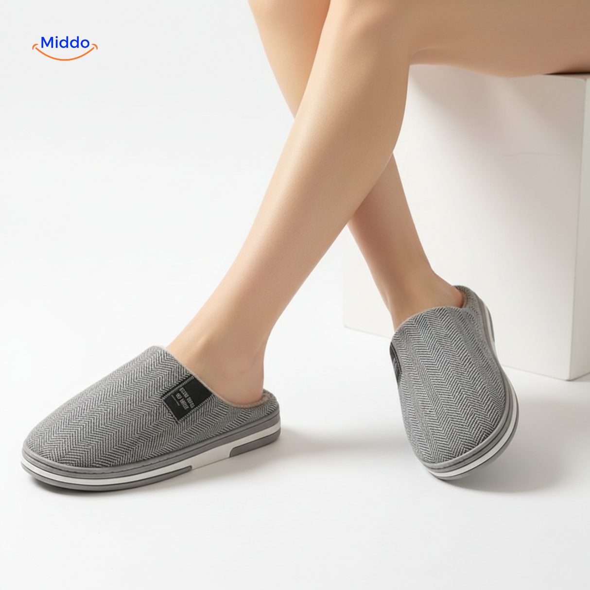 Pink cotton slippers with soft lining and slip-resistant sole.