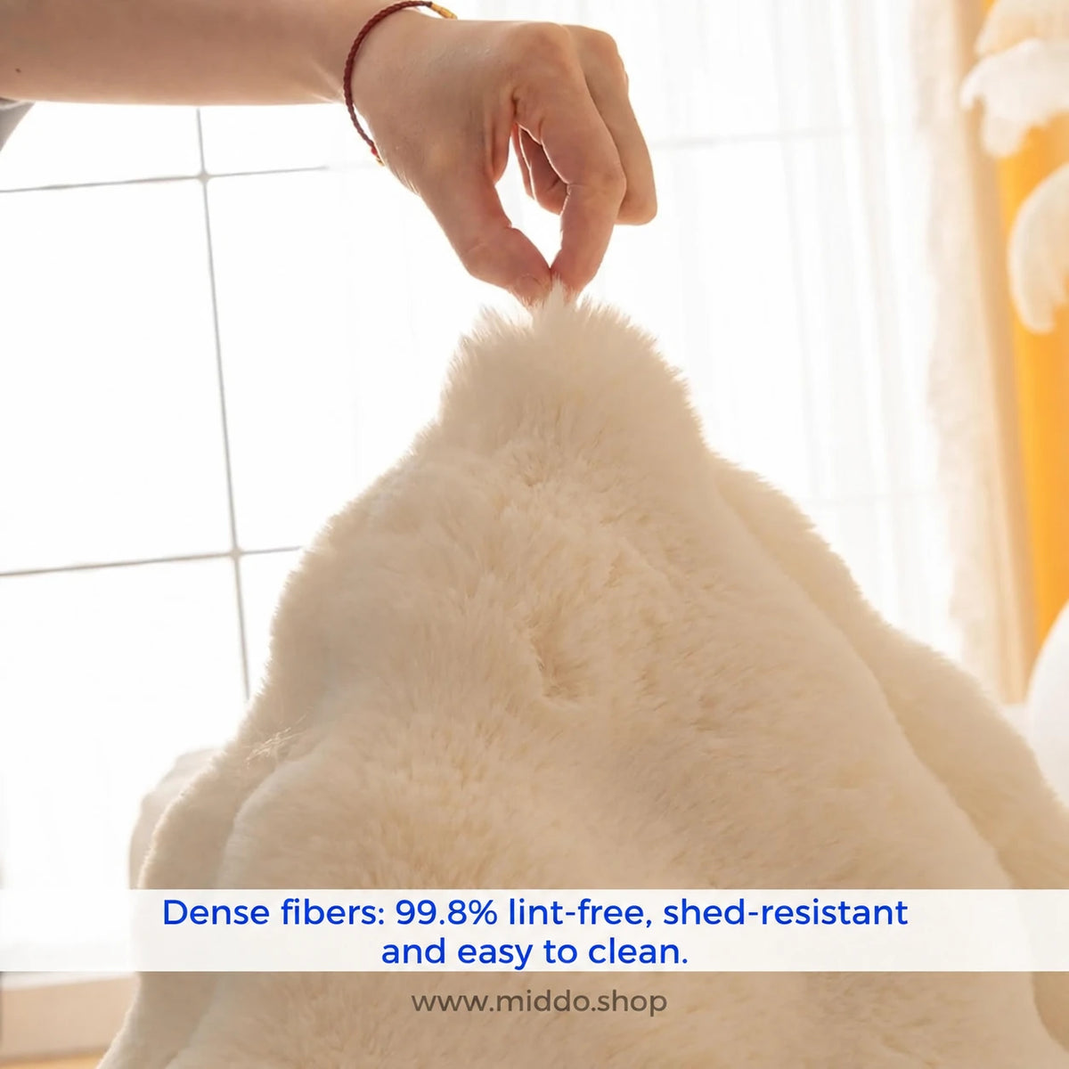 Plushy dense lint-free cream plush fabric close-up