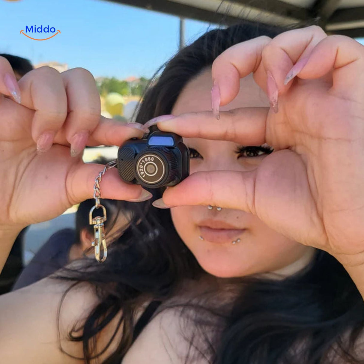 Lightweight portable video camera held in student's hands for quick recording