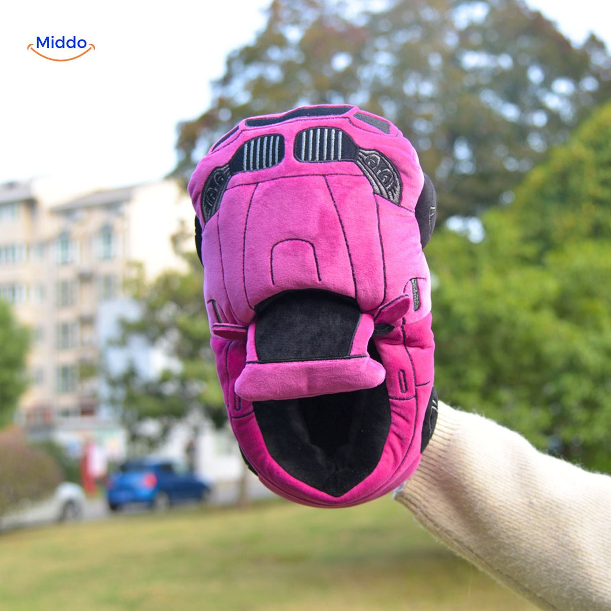 Black car slippers providing plush comfort for relaxing home footwear.