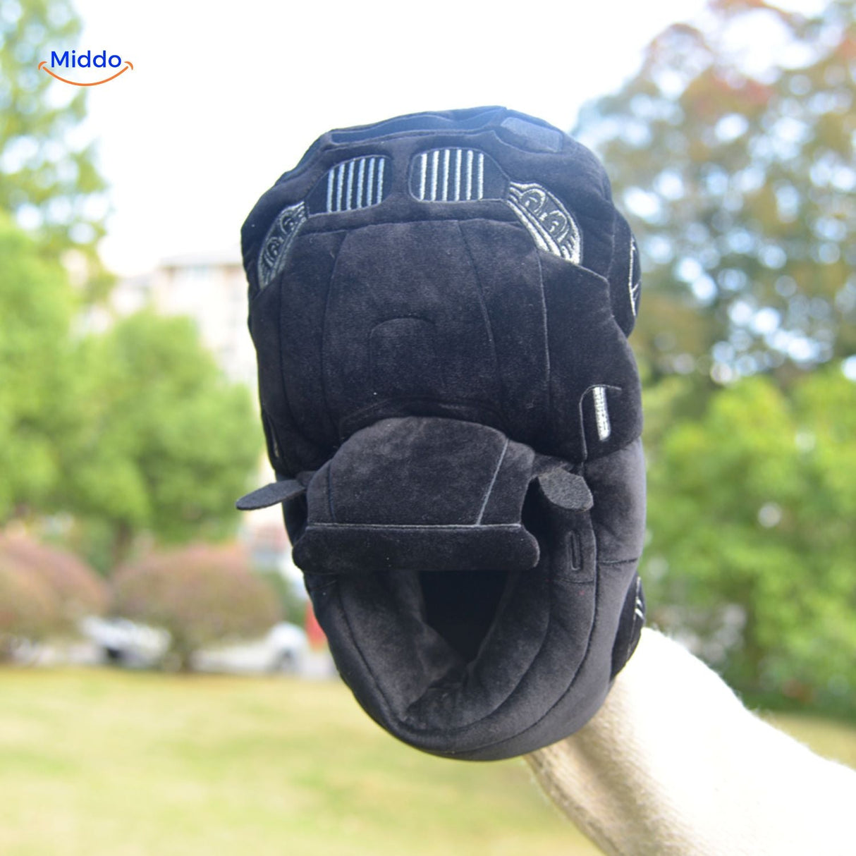 Black racecar slippers featuring sleek car model styling for home.