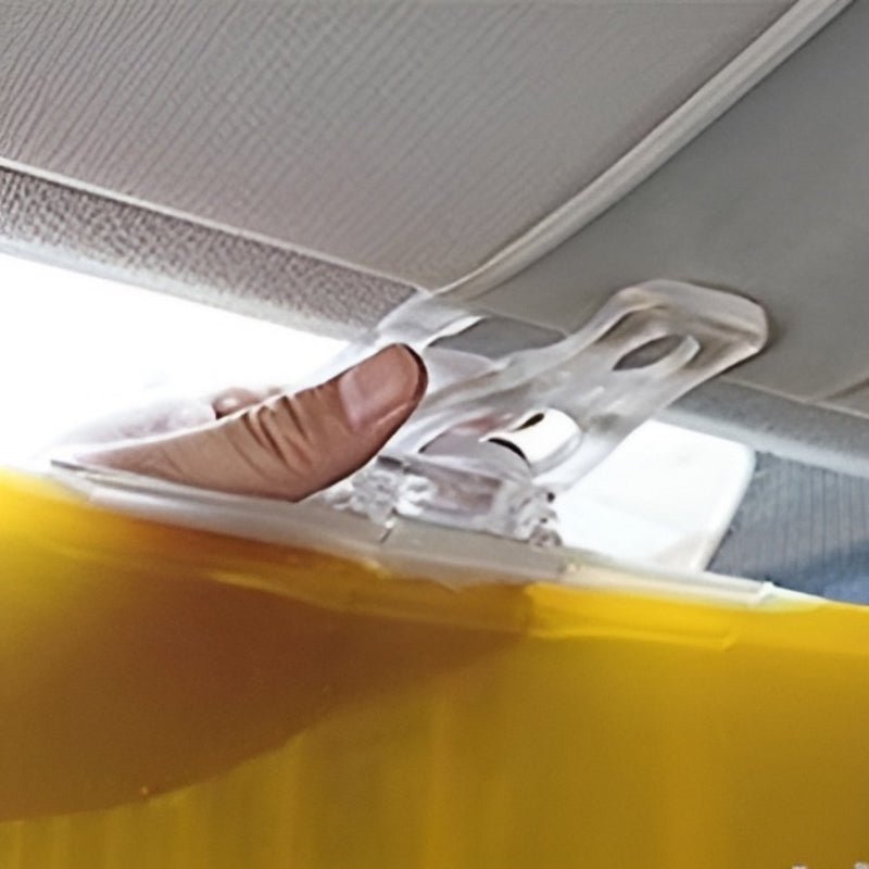 Hand placing SafeDrive car visor on windshield during easy installation.