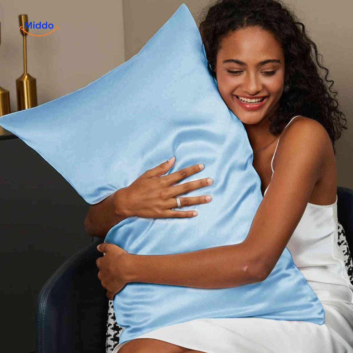 Blue satin pillowcase on pillow for healthy hair skin.