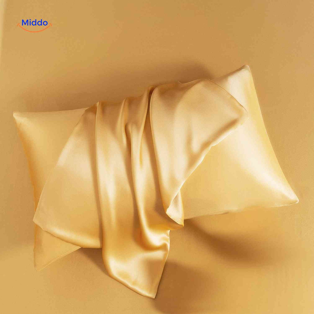 Gold satin pillowcase flat lay showcasing elegant color option.