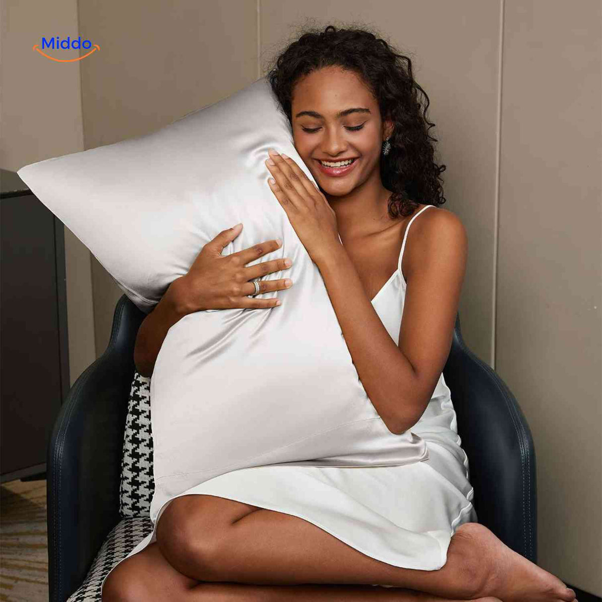 Silver satin pillowcase styled for hair protection benefits.