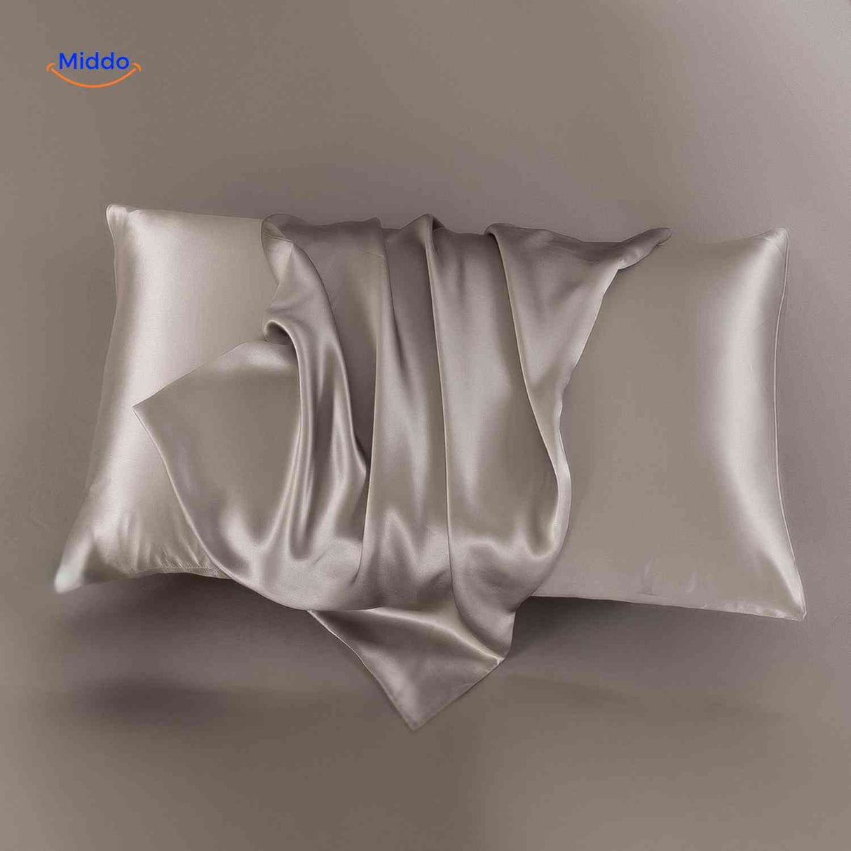 Taupe satin pillowcase displayed flat neutral elegant tone.