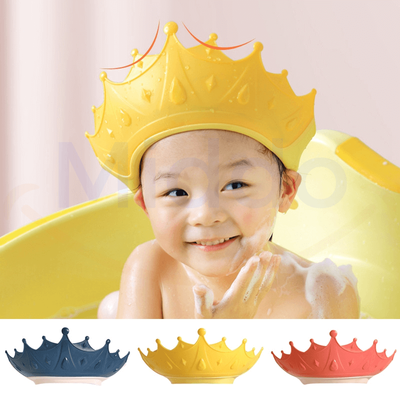 Child wearing yellow ShampooCrown shower shield while bathing safely.