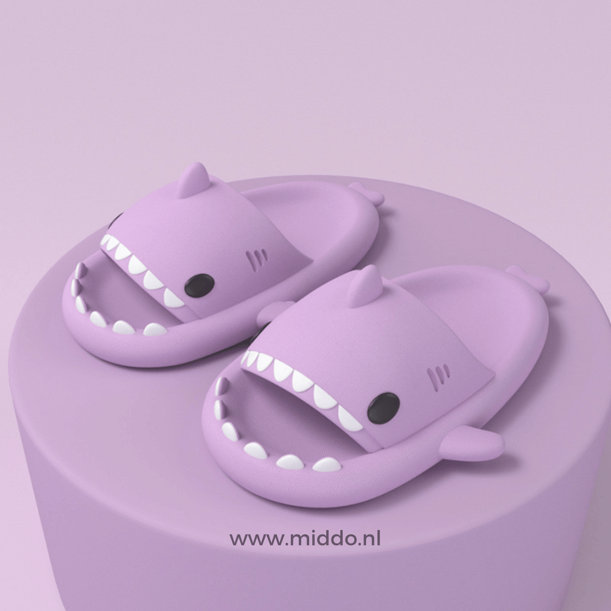Sharkies shark slippers in purple with soft, cushioned footbed.