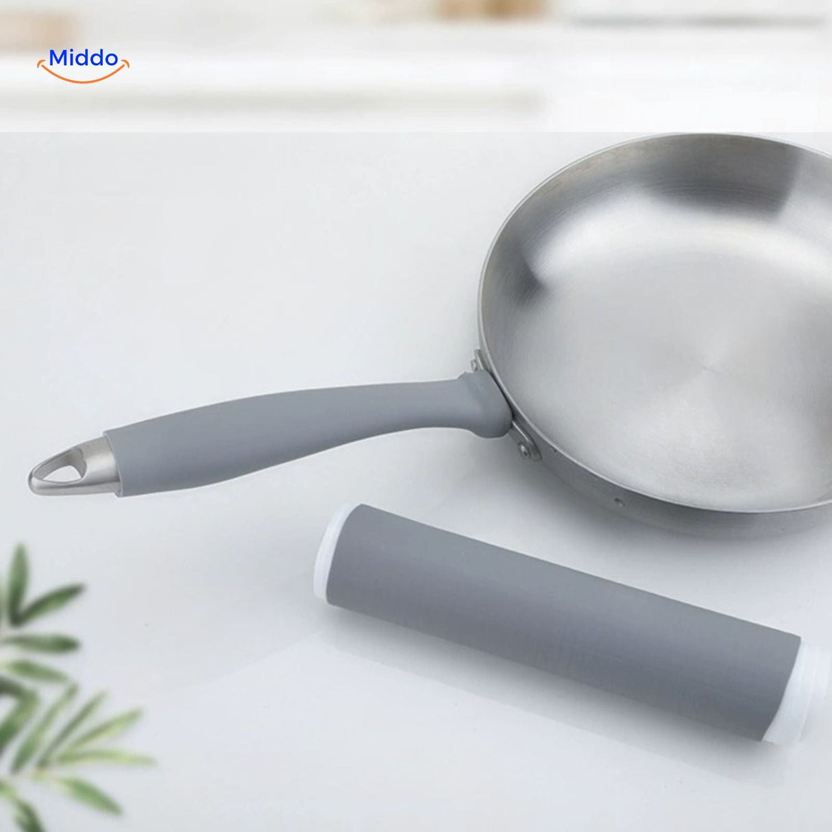 Grey silicone handle protector with heat-resistant anti-slip grip for pans and cookware.