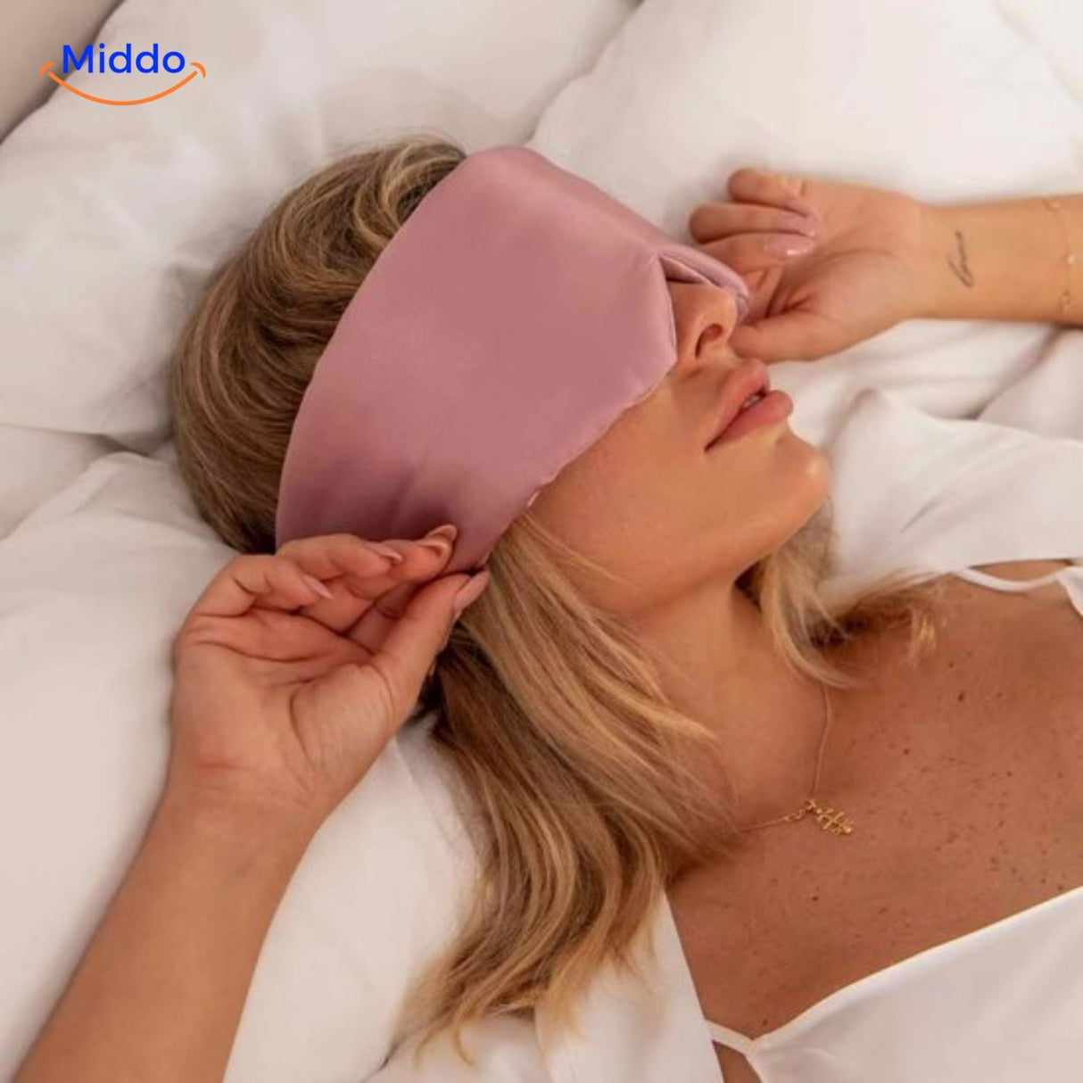 Model wearing black silk sleep mask demonstrating comfortable fit and light-blocking coverage.