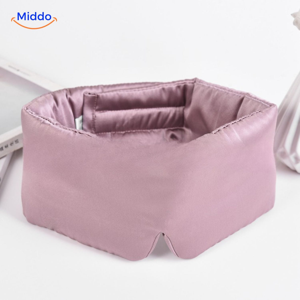 Light pink mulberry silk sleep mask with soft satin finish for superior sleep quality.