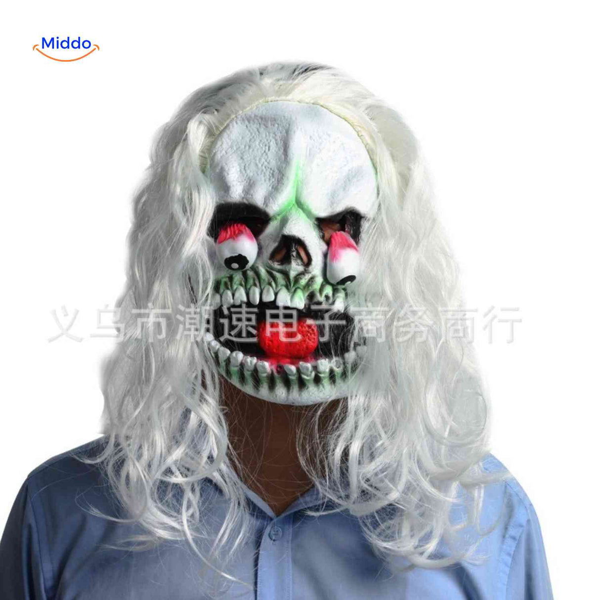 Monstrous skull mask with bulging eyes and white curly hair.