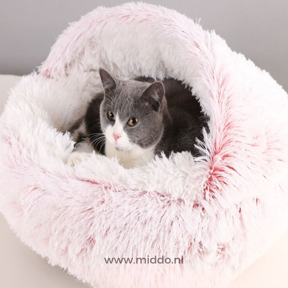 Soft round-shaped SoftSnuggle pet bed in pink for dogs and cats.