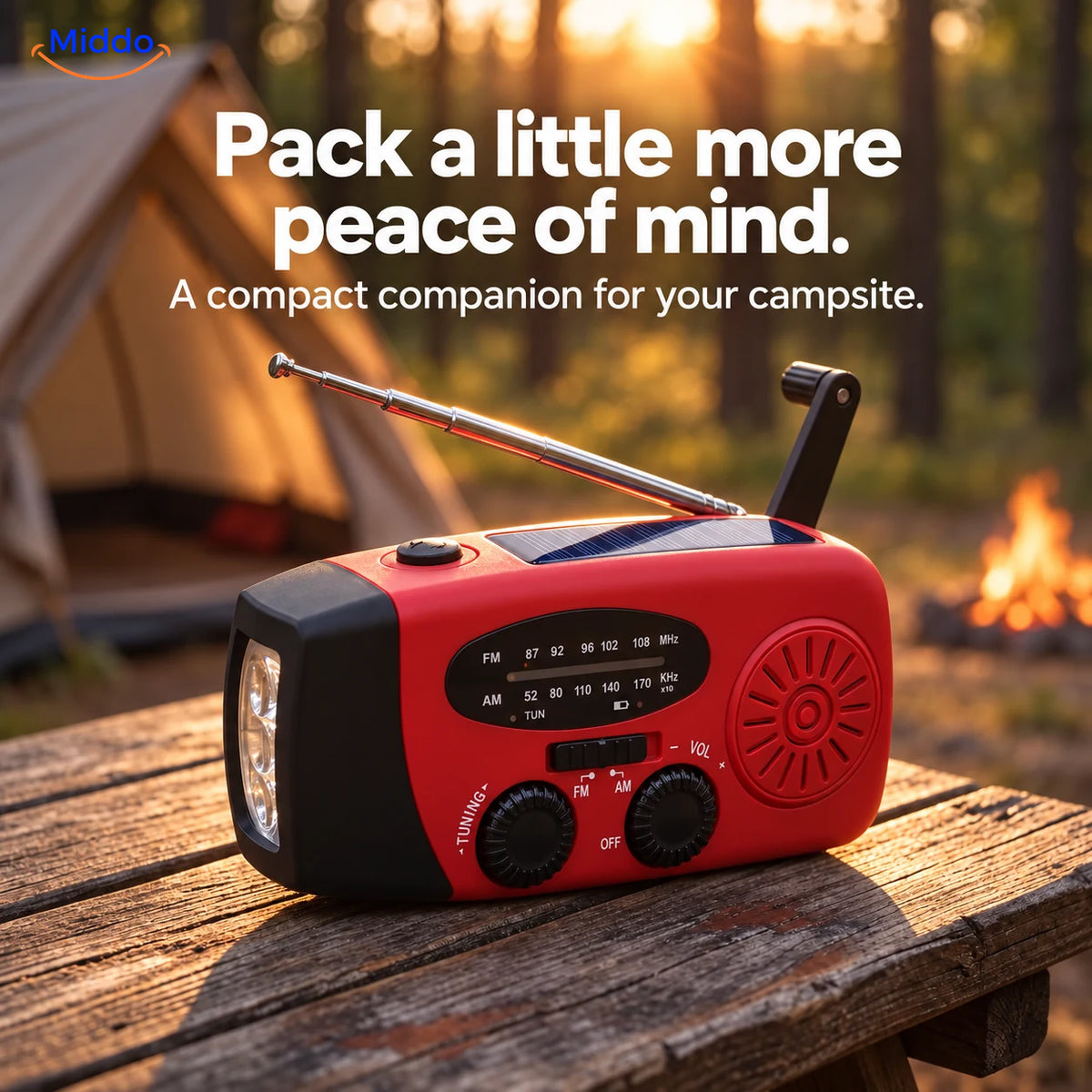 Red SolarPower Pro hand-crank radio on a camping table with a tent in the background