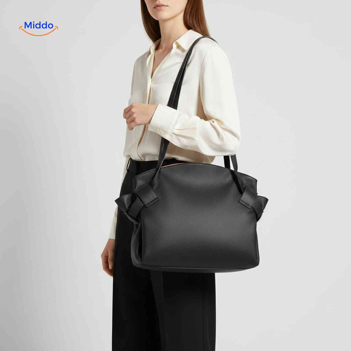 Spacious foldable women's handbag with long adjustable shoulder strap.