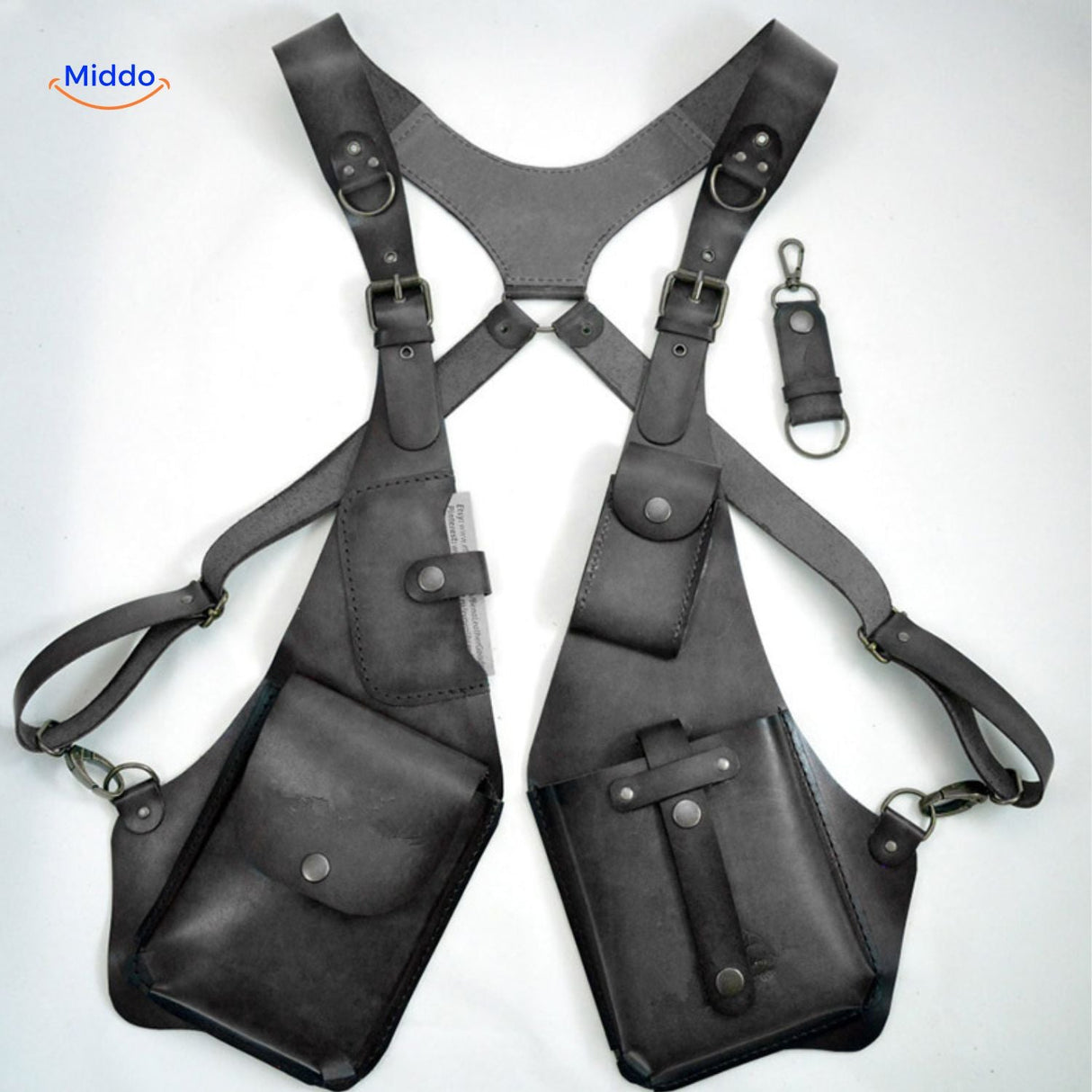Grey steampunk shoulder bag with visible hanging interior compartments.